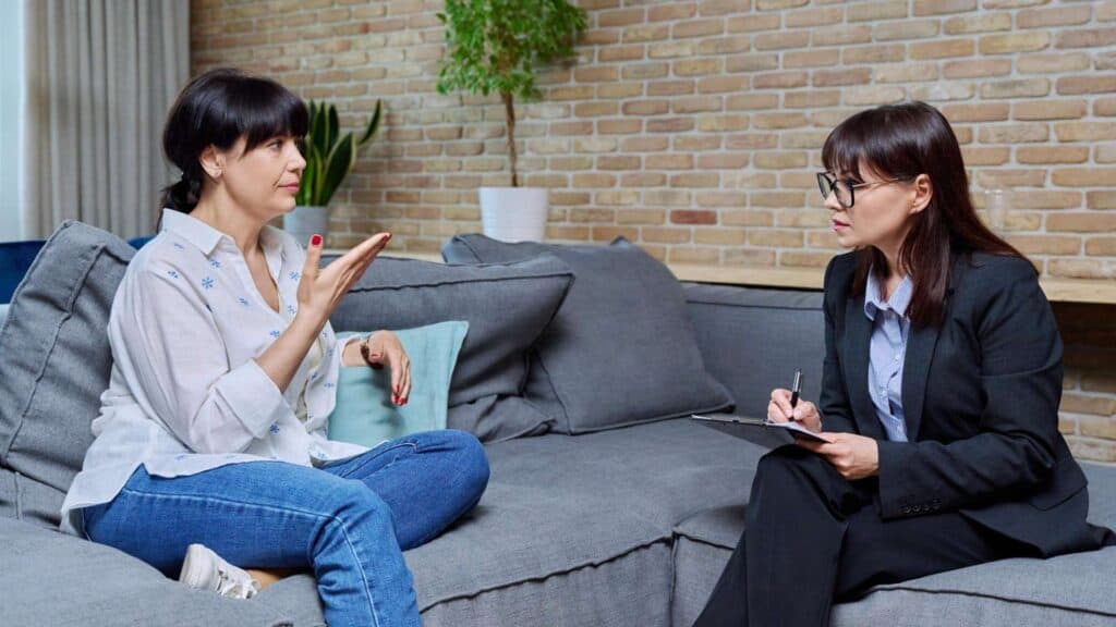 Two women engaged in a supportive counseling session at a Mental Health IOP in Orange County