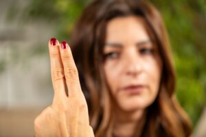 An Irvine EMDR specialist holding up two fingers to guide a client through a structured trauma desensitization and reprocessing phase.